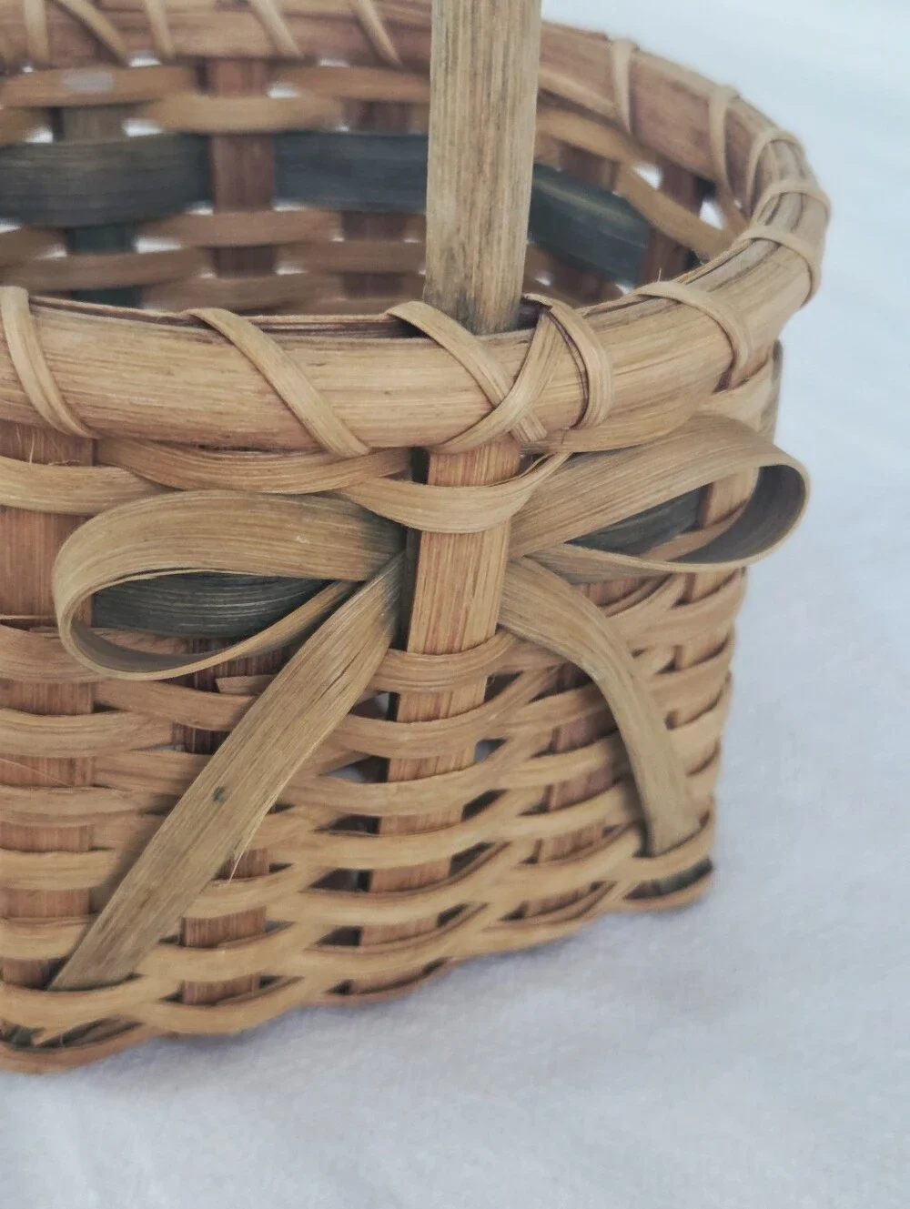 Vintage, Hand-Woven Basket Featuring A Unique Bow Detail And Green Accent
